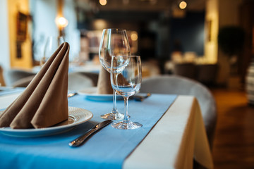 Served banquet restaurant table with wine glasses