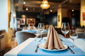 Served banquet restaurant table with wine glasses