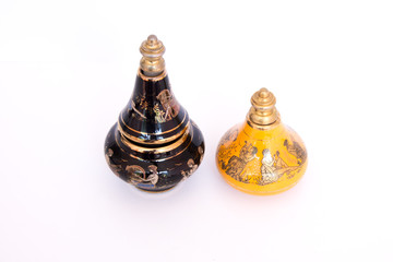 Two vials of under the spirits stand on a white background, the view from the top. on the bottle is...