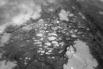 Pit in the old broken road.