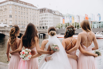 Naklejka premium The morning of the bride. Bride with friends. Wedding preparations.