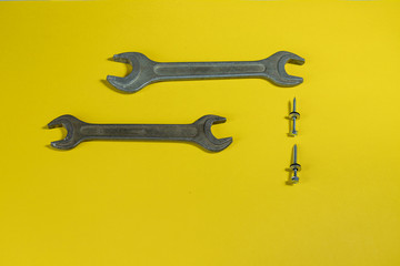 working tools. wrench for housework. colored background. tools for the house. steel reliable wand keys on a colored background. tools for manual worker