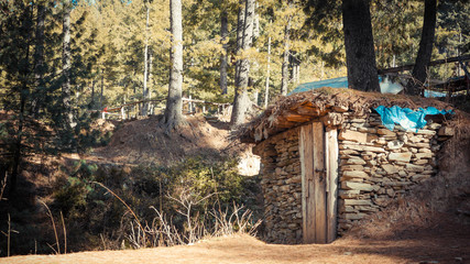Stone wall shack with trees in the distant