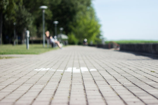 walkway of the nka embankment with the image of a family
