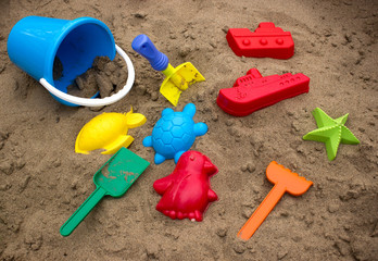 Children's sandbox with toys and molds