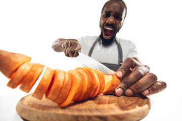 Amazing african-american man preparing unbelievable food with action, details and bright emotions,...