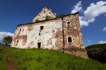 Fototapeta na wymiar Church of the Assumption of the Virgin Mary near the Chervonohrad castle, Ternopil, Ukraine