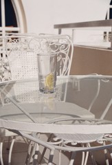 white restaurant tables with decorations and glasses