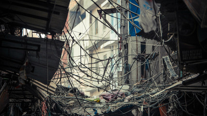Wires tangled in the middle with building