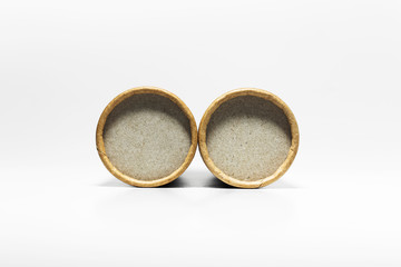 Close-up of two round cardboards isolated on white background.