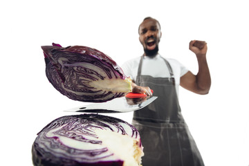 Amazing african-american man preparing unbelievable food with action, details and bright emotions,...