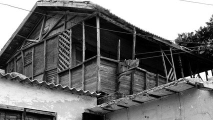 Wooden house on top of concrete walls