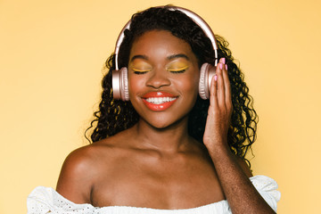 Woman listening to music through her headphones