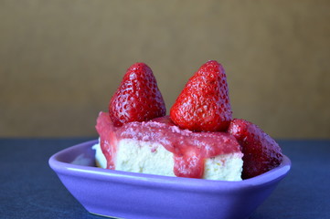 ice cream with strawberries on a bowl