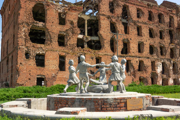 Volgograd/Russia-18.06.2016:The statue of with circle of kids and crocodile and destroyed building