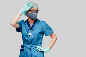 Fototapeta na wymiar female doctor with stethoscope wearing protective mask and latex gloves over light grey background