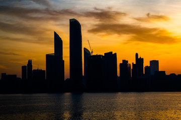 Fototapeta na wymiar a beautiful sunrise view of Abu Dhabi City from Marina Breakwater Abu Dhabi, UAE, morning, Abu Dhabi sunrise, golden hour