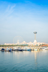 Obraz premium A far view of Abu dhabi marina mall with water front.