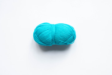top view of blue wool yarn on white background