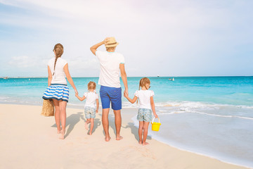 Naklejka premium Photo of happy family having fun on the beach. Summer Lifestyle
