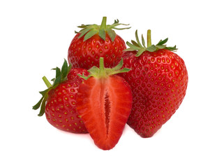 Isolated strawberries. Three fruits, one cut in half on a white background