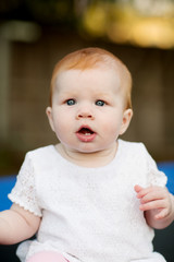 Portrait of cute seven month old baby girl