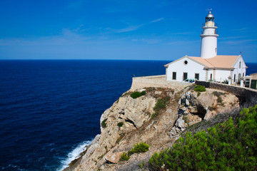 Fototapeta na wymiar Old lighthouse on a cliff