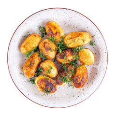 Fried fresh potatos and dill on a plate isolated on a white background. Top view