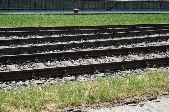 Hardened steel railroad tracks photographed on a sunny spring day