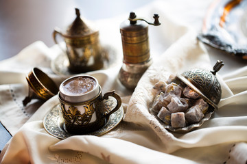 Turkish coffee with delight and traditional copper serving set. Feast of Ramadan.
