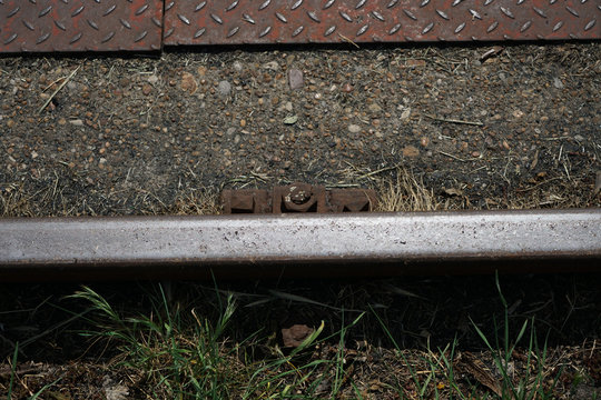Hardened steel railroad tracks photographed on a sunny spring day