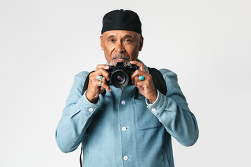 Senior man with a digital camera