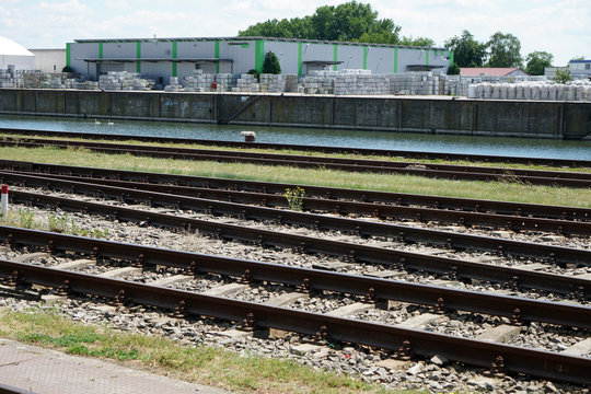 Hardened steel railroad tracks photographed on a sunny spring day