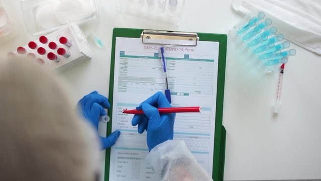 Positive test for coronavirus covid-19. Registration of covid-19 positive blood sample. The work of medical laboratories during the sars-cov-2 pandemic