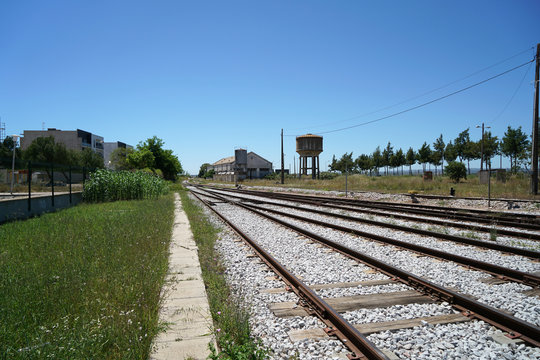 Hardened steel railroad tracks photographed on a sunny spring day