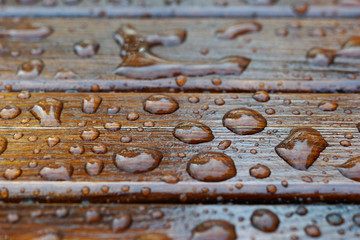 Background of water drops on a wooden surface