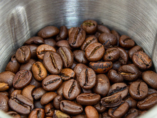 Closeup picture of coffee bean grinder and coffee bean