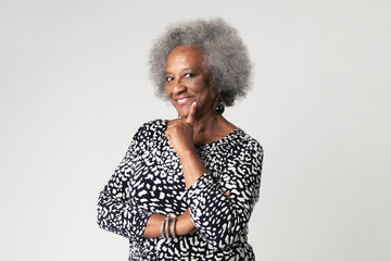 Cheeky black senior woman with afro hair