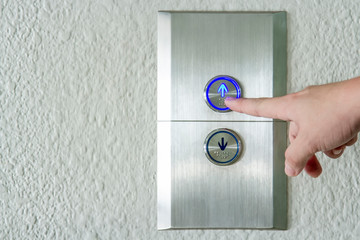 Using hands, press the elevator up and keypad elevator © CHOKCHAI