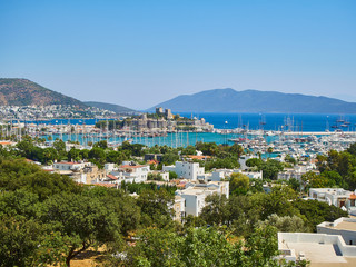 Bodrum, Mugla Province, Turkey. Kumbahce bay with the Castle of Saint Peter in the background.