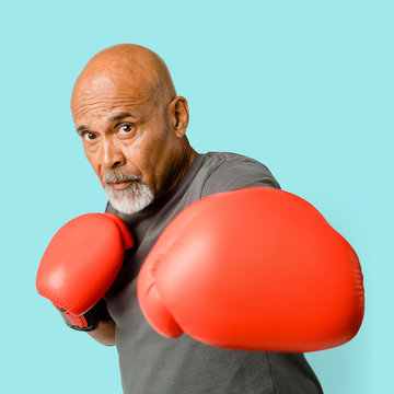 Senior man with red boxing gloves mockup