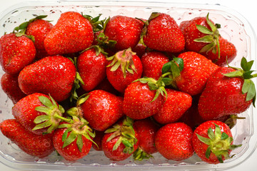 Minimal food concept. Strawberries on a white background. Top view. Close up. Tasty berries.