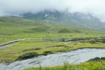 Fototapeta na wymiar Green summer mountains landscape in Dargavs, North Ossetia - Alania, Caucasus, Russia