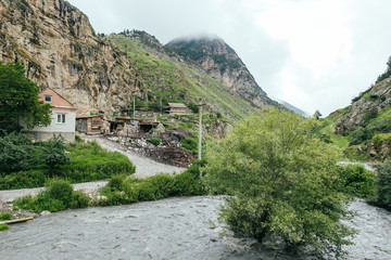 Fototapeta na wymiar North Ossetia Alania, Kurtata gorge, river in Caucasus mountains, village and fortress, Russia