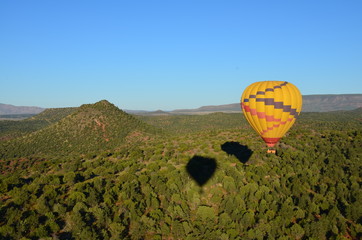 Flying in hot air balloon over the mountains in Sedona Arizona USA