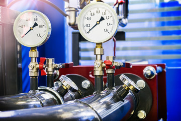 high pressure gauges installed on a water or gas system. Selective focus