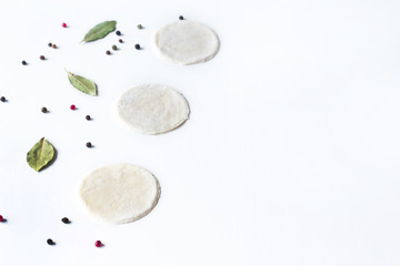 on a white background lay blanks for modeling dumplings: tortillas and spices. sculpt dumplings