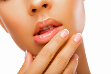 Sexy Lips closeup. Beautiful Portrait Girl natural Lip. Closeup. Female Model Mouth With Smooth Perfect Skin And Natural Manicure Touching Her Plush Lips. Lip Care And Beauty. Lip gloss      