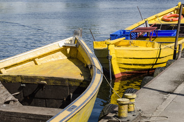 Naklejka premium A SMALL FISHING PORT - Traditional fishing boats moored at the quay