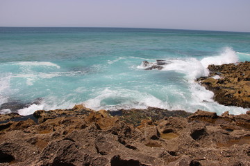 waves crashing on rocks